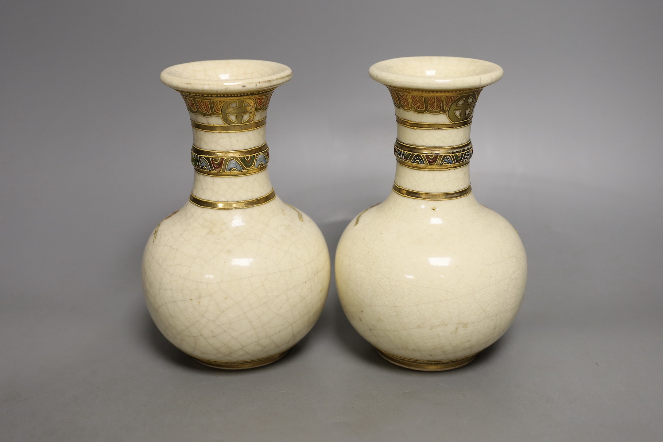 A pair of Japanese Satsuma vases, signed, 17 cms high.